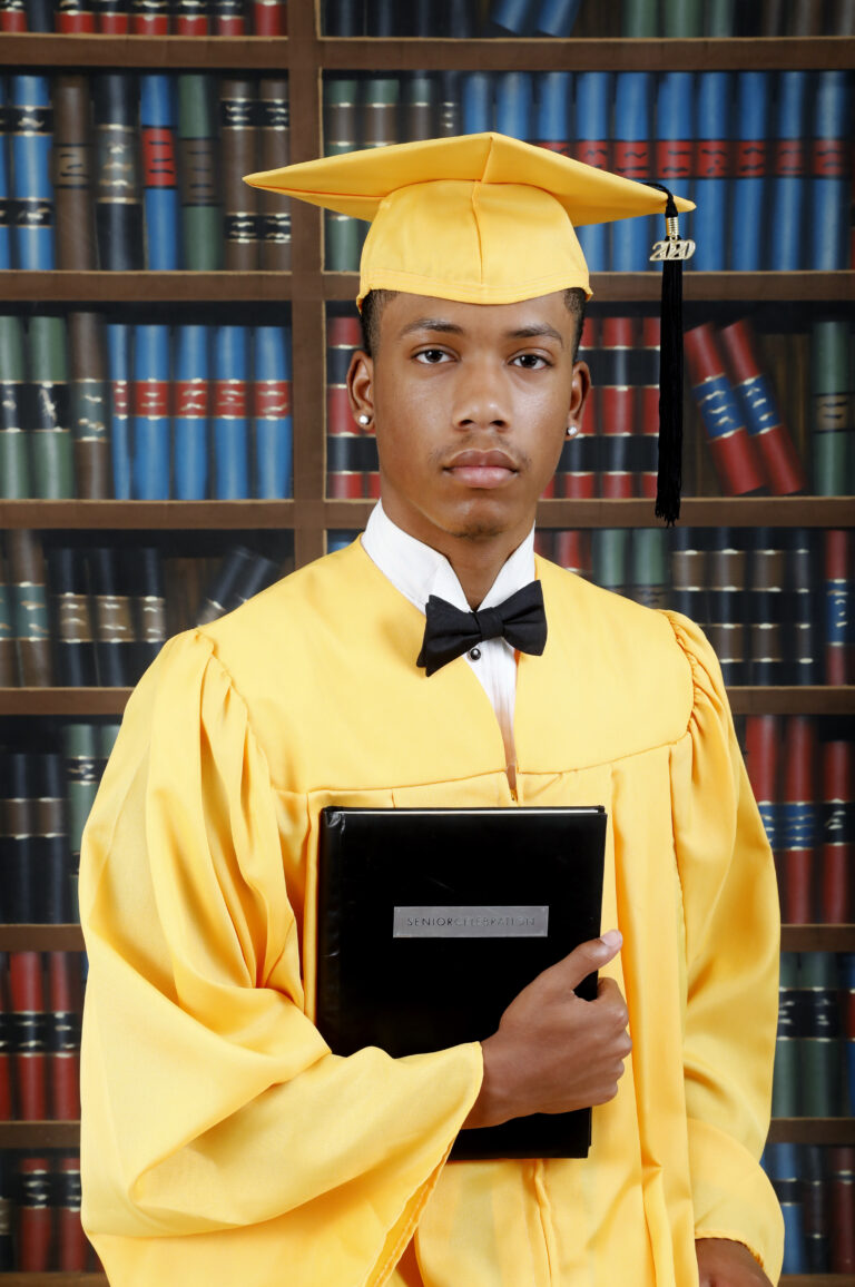 Male Student in Yellow Graduation Gown